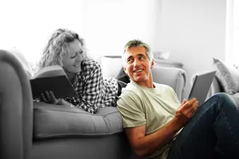 Couple on the sofa reviewing their finances