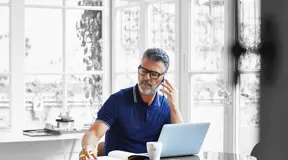 Person on phone taking notes