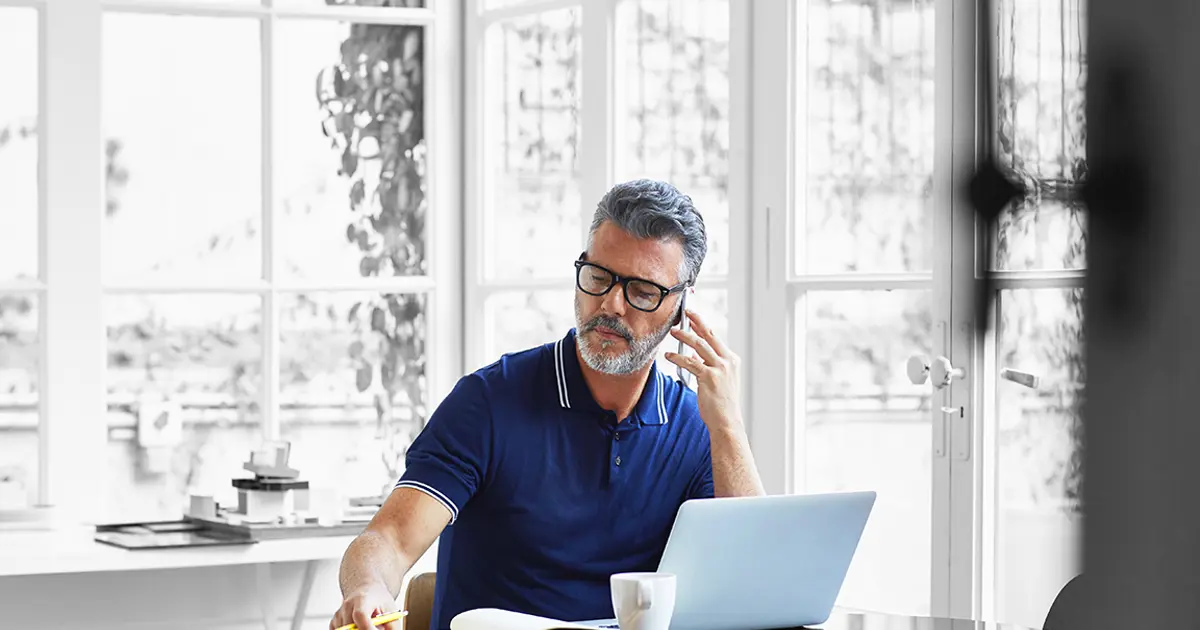 Person on phone taking notes