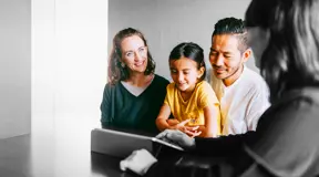 Family talking to a mortgage broker