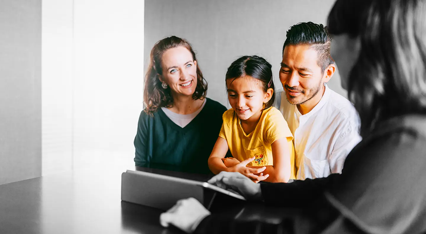 Family talking to a mortgage broker