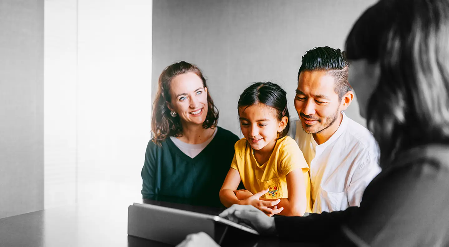 Family talking to a mortgage broker
