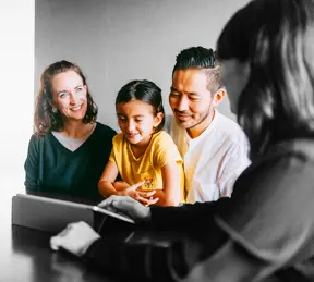 Family talking to a mortgage broker