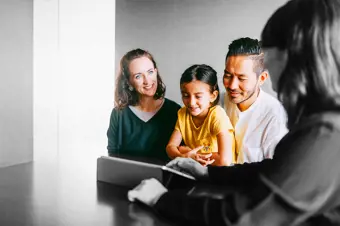 Family talking to a mortgage broker