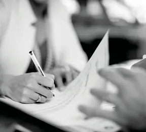 Person signing contract