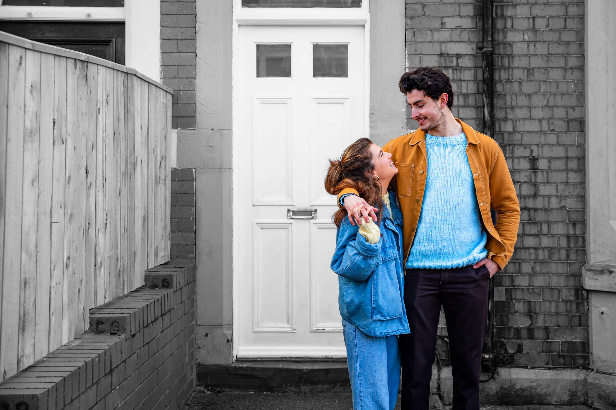 Young couple outside their new home