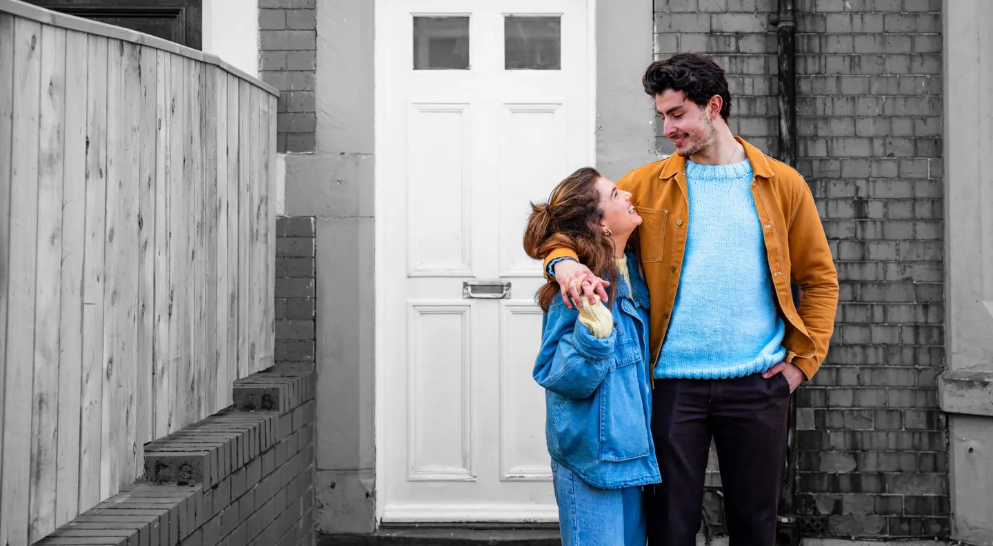 couple outside house