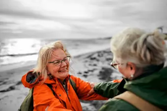 Friends hugging on beach