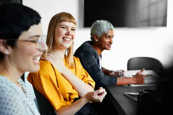 Colleagues smiling in meeting