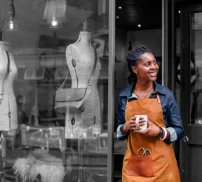 Business owner outside shop 