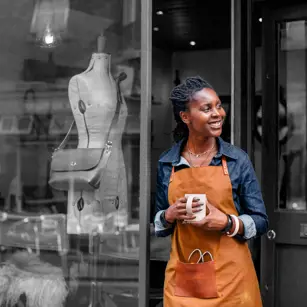 Business owner outside shop