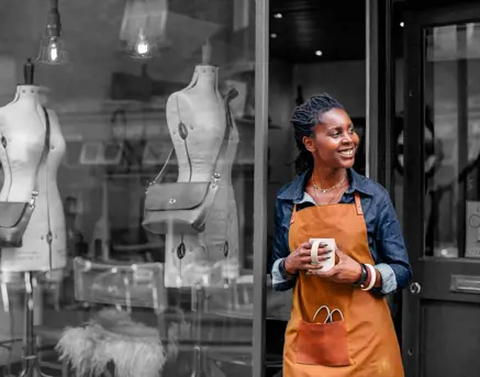 Business owner outside shop