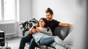 Couple on the sofa in new home