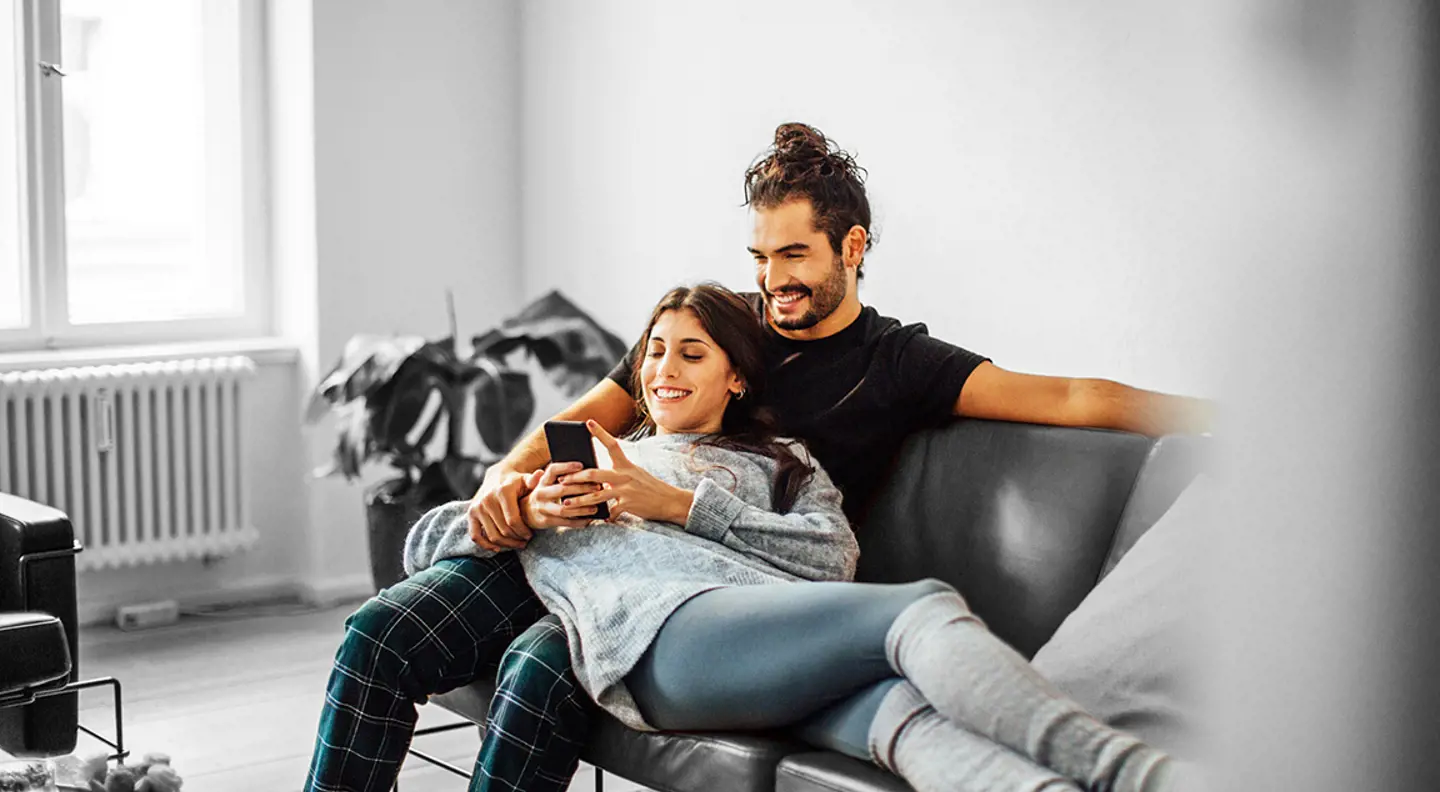 Couple on the sofa in new home