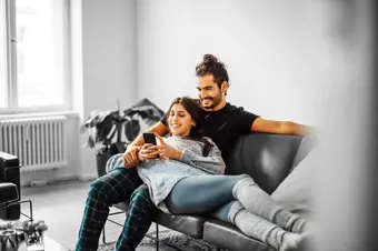 Couple on the sofa in new home