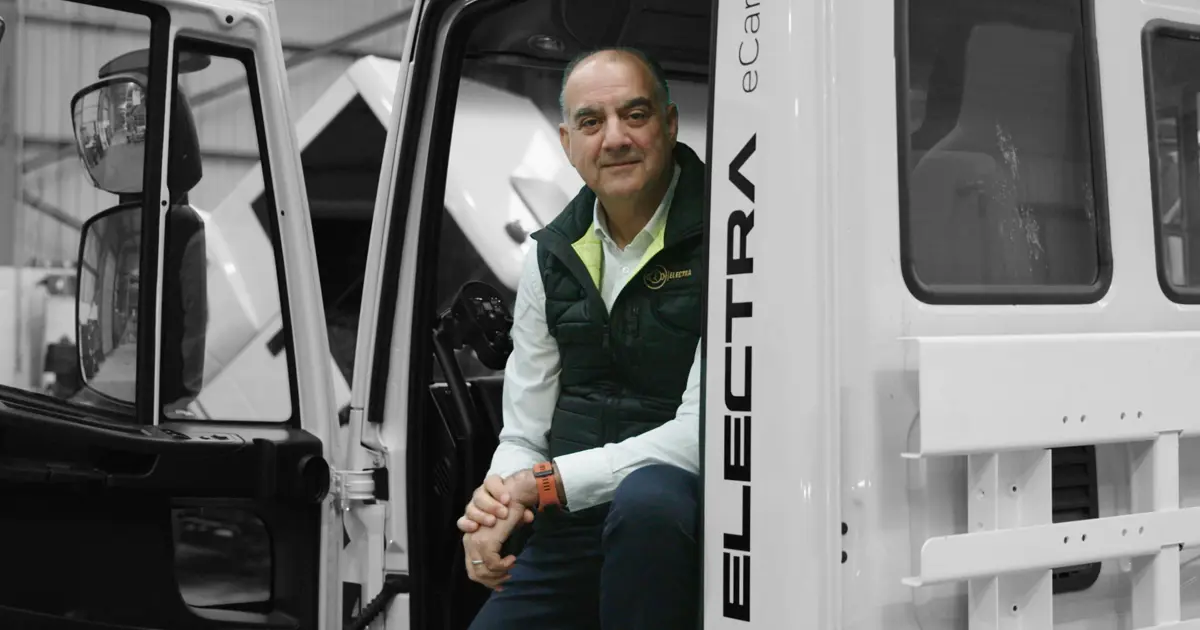 Sid Sadique of Electra Commercial Vehicles sitting in one of the vehicles.