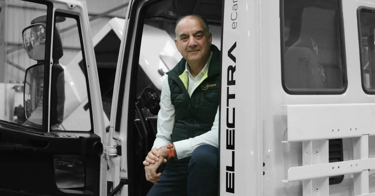 Sid Sadique of Electra Commercial Vehicles sitting in one of the vehicles.