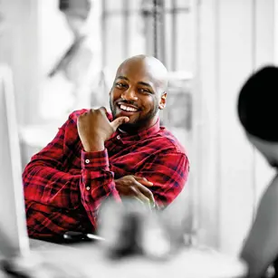 Person smiling at desk