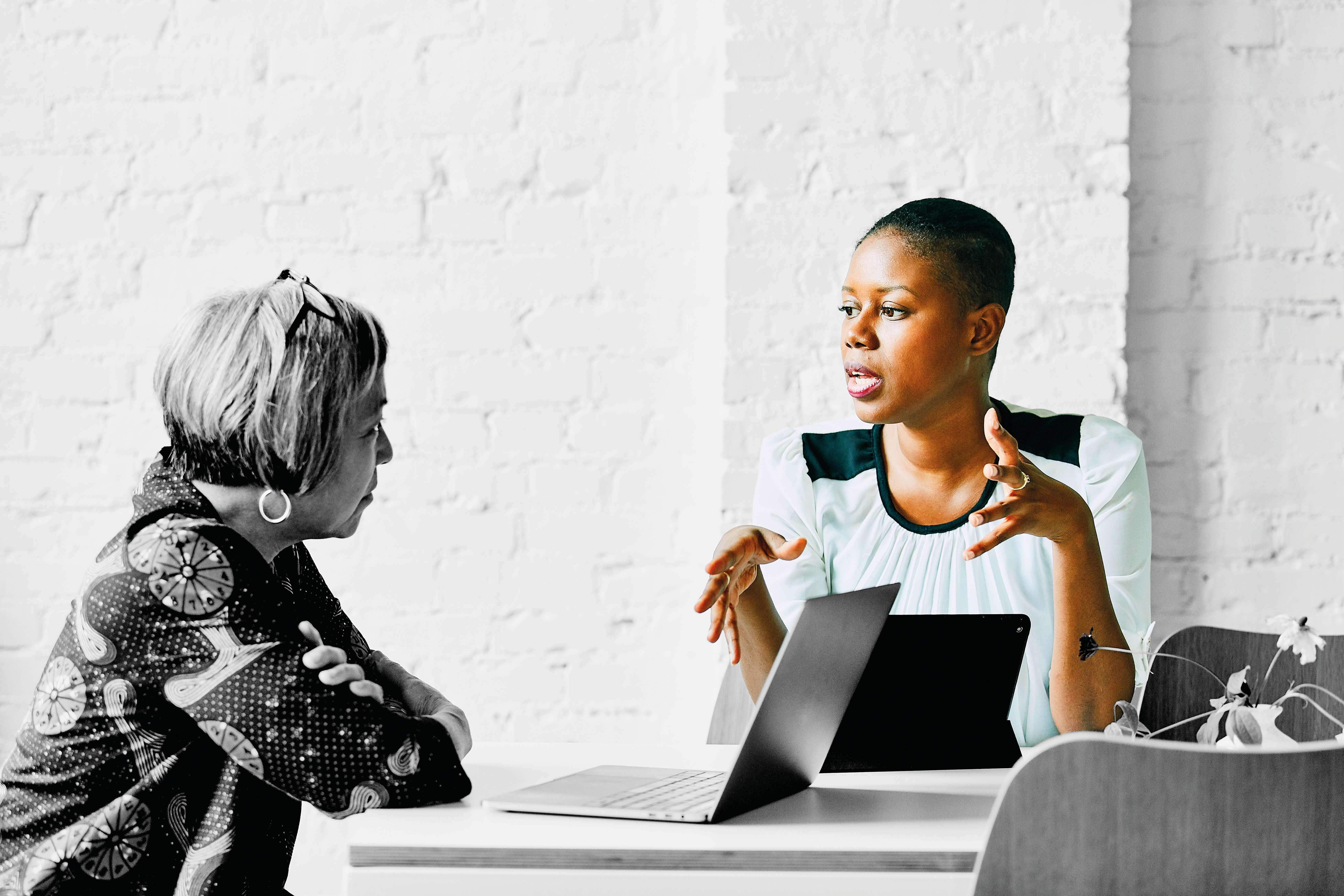 People in a meeting deep in conversation