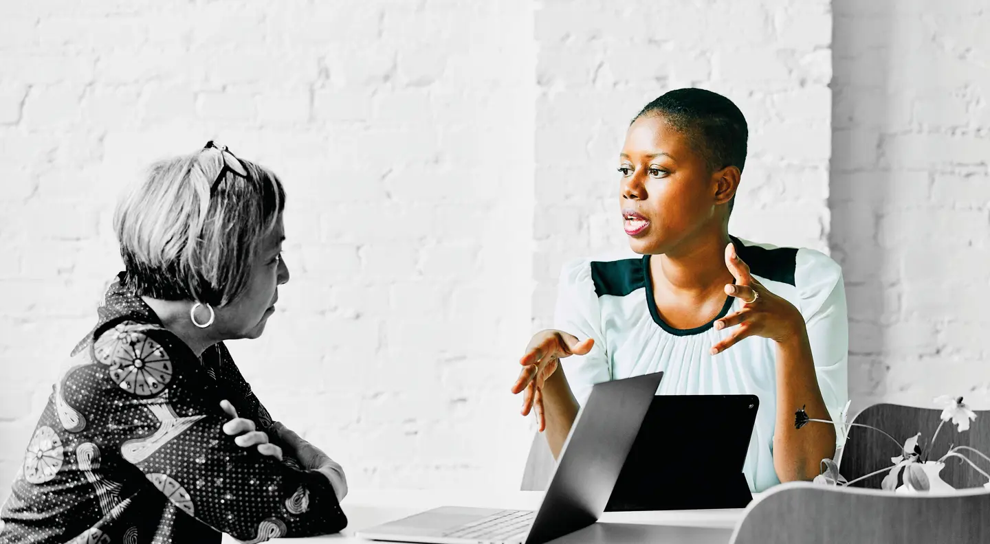 People in a meeting deep in conversation