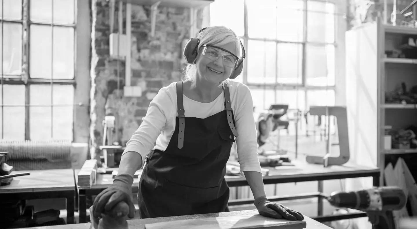 Workshop mechanic using sander 