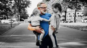 Grandparent holding grand kids