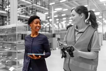 Two people in a factory
