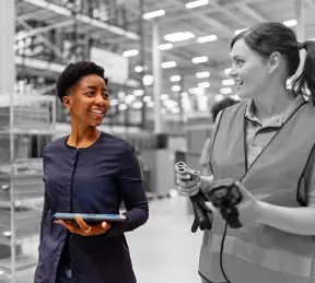 Two people in a factory