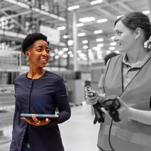 Two people in a factory