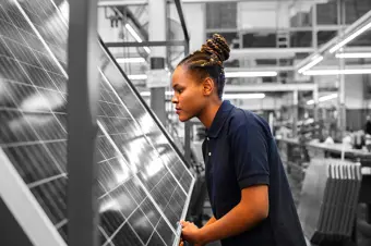 Person making solar panels