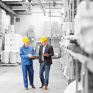 People walking through warehouse