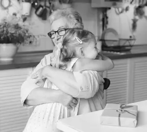 Woman hugging young girl