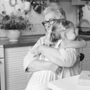 Woman hugging young girl 