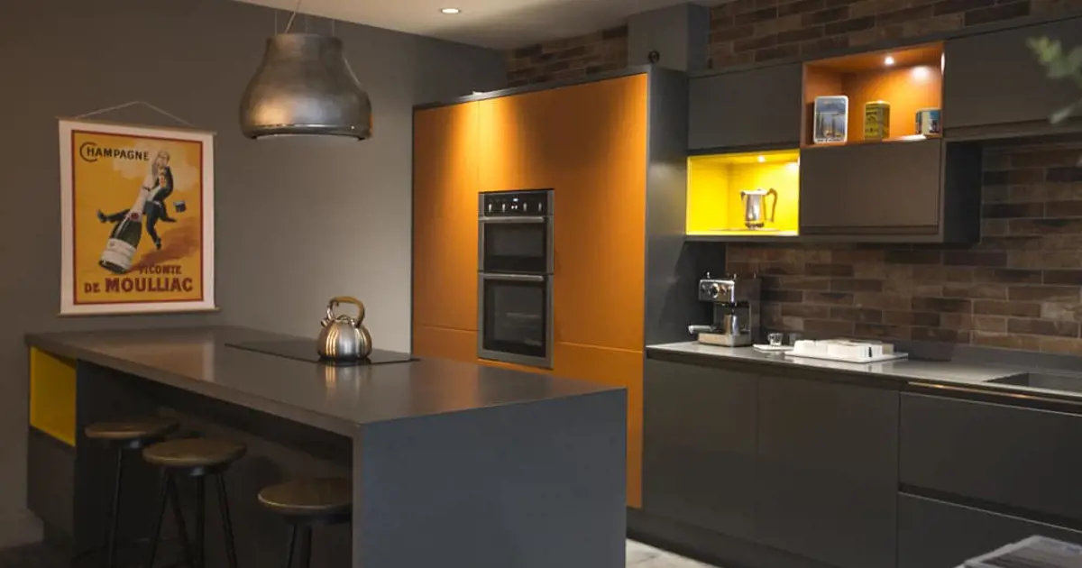A modern grey and yellow kitchen design from System Six Kitchens.