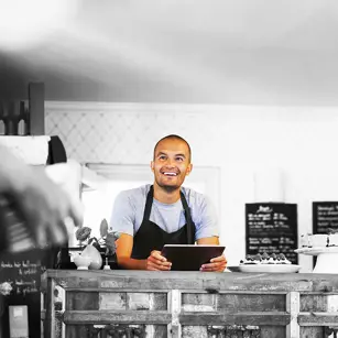 Smiling café owner