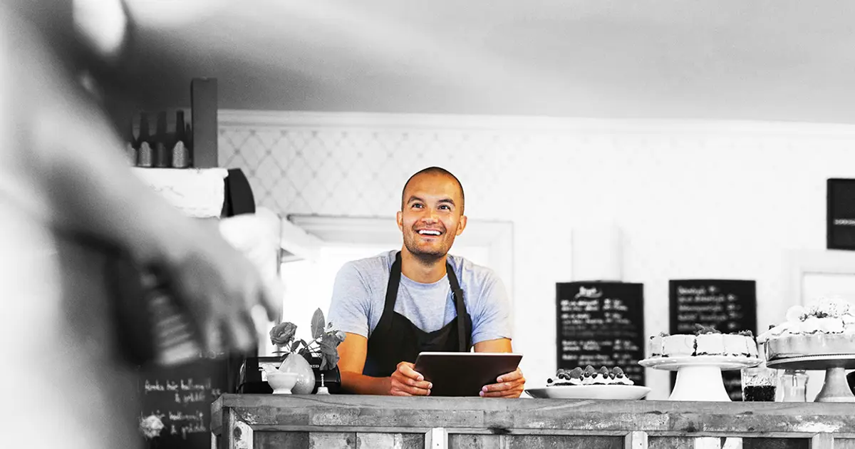 Smiling café owner