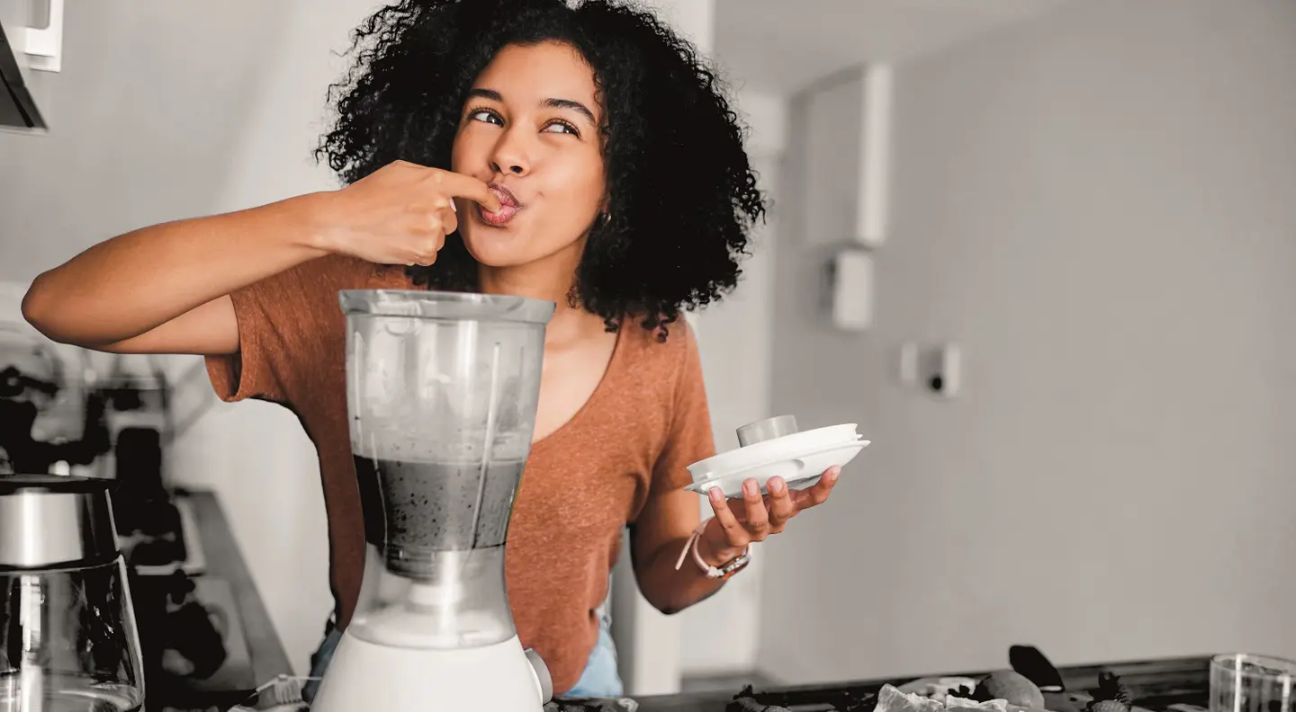 Person enjoying a freshly made smoothie