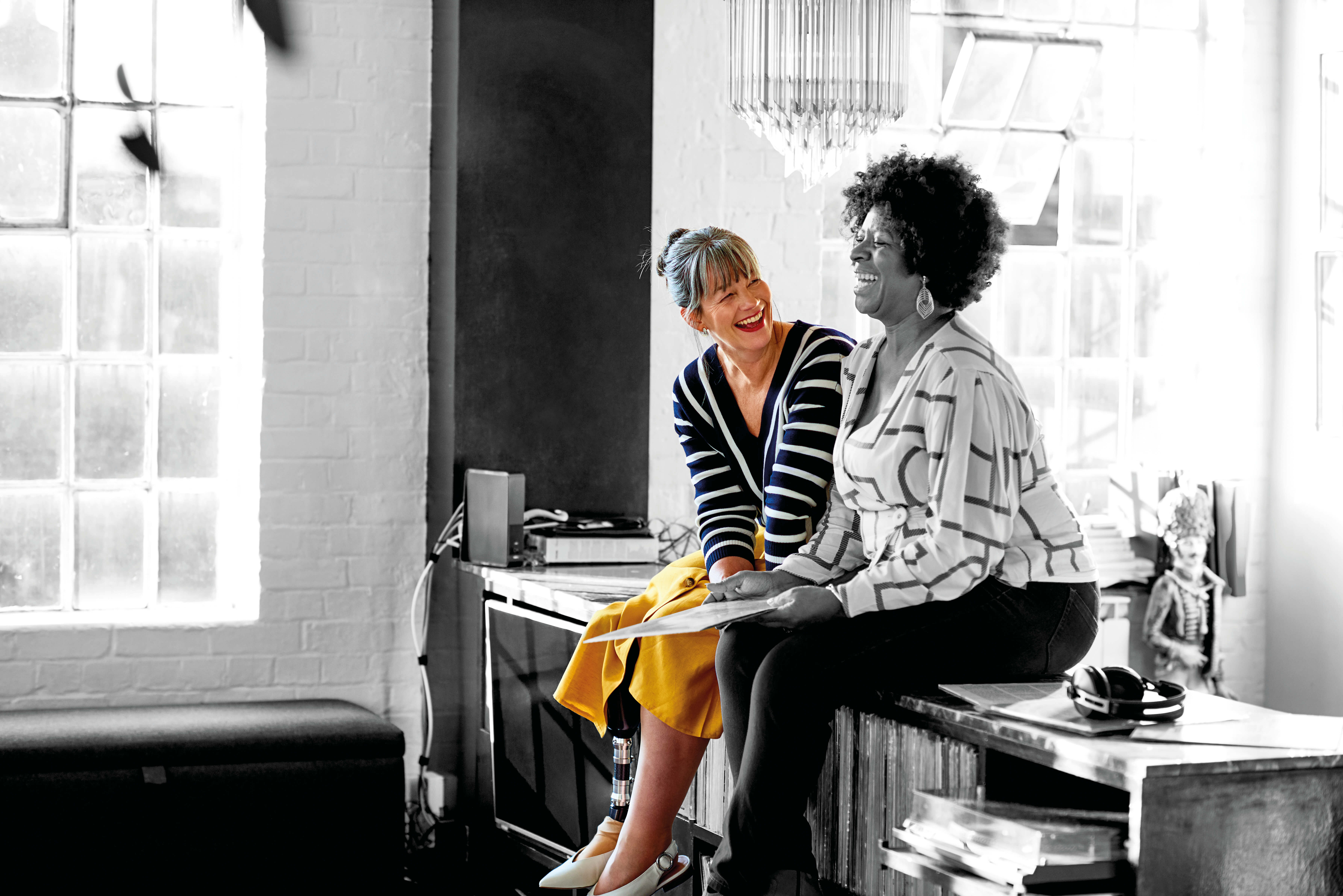 Two friends laughing together