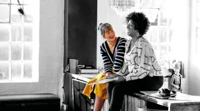 Two friends laughing together